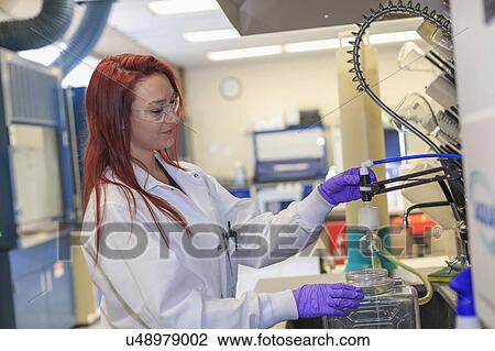 Chemist working with reagent supply. View Large Photo Image Stock Image - Chemist working with reagent supply.. Fotosearch
