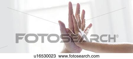 Child and adult touching hands. View Large Photo Image Stock Image - Child and adult touching hands.. Fotosearch