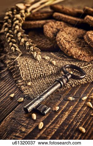 Stock Photo - Chocolate chip cookies and old key. Fotosearch