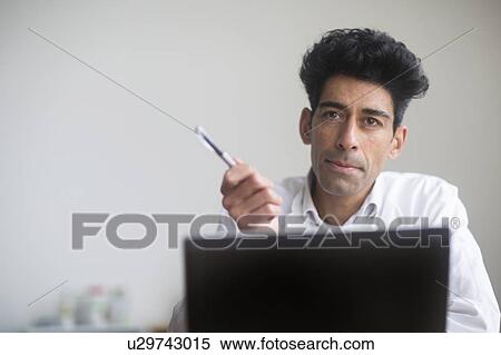 Stock Photography - Doctor discussing X-ray with patient. Fotosearch