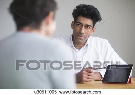 Doctor with paperwork View Large Photo Image Stock Photography - Doctor with paperwork. Fotosearch