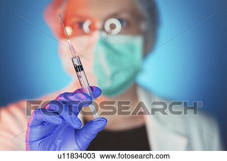 Doctor with syringe View Large Photo Image Stock Image - Doctor with syringe. Fotosearch