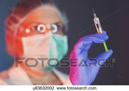 Doctor with syringe View Large Photo Image Stock Image - Doctor with syringe. Fotosearch