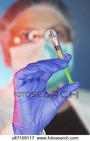 Stock Photo - Doctor with syringe. Fotosearch