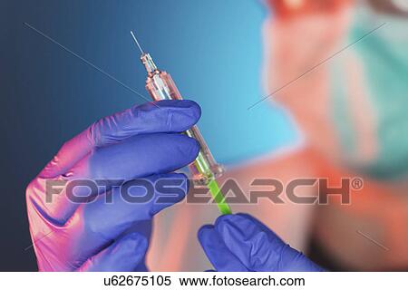 Doctor with syringe View Large Photo Image Stock Photography - Doctor with syringe. Fotosearch