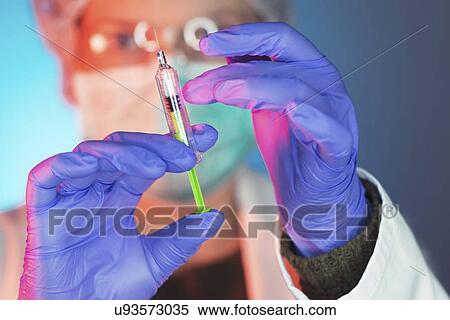Doctor with syringe View Large Photo Image Stock Photography - Doctor with syringe. Fotosearch