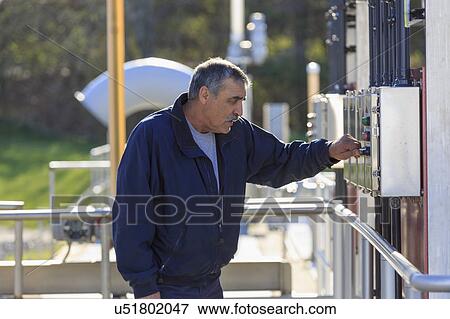 Engineer at water treatment control panel. View Large Photo Image Stock Photo - Engineer at water treatment control panel.. Fotosearch