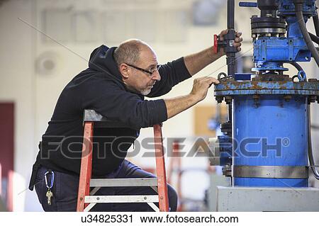 Engineer in water treatment plant. View Large Photo Image Stock Image - Engineer in water treatment plant.. Fotosearch