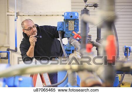 Engineer in water treatment plant. View Large Photo Image Stock Photography - Engineer in water treatment plant.. Fotosearch