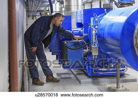 Stock Photo - Engineer working on sensors.. Fotosearch