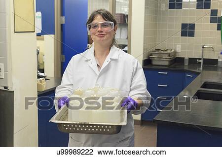 Lab technician preparing sample bottles. View Large Photo Image Stock Image - Lab technician preparing sample bottles.. Fotosearch