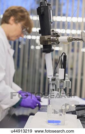 Lab technician recording data from sample test. View Large Photo Image Stock Photo - Lab technician recording data from sample test.. Fotosearch