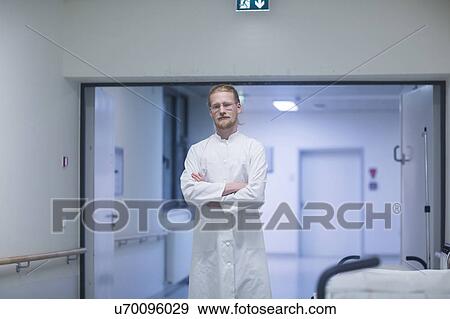 Male doctor in hospital corridor View Large Photo Image Stock Photo - Male doctor in hospital corridor. Fotosearch