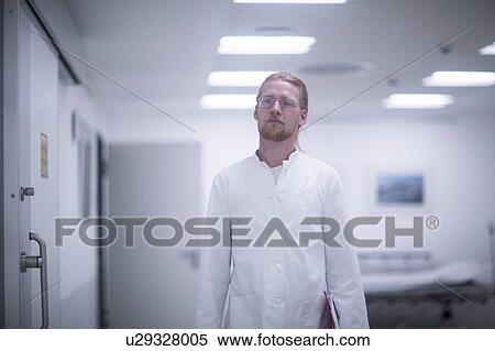 Male doctor in hospital corridor View Large Photo Image Stock Photography - Male doctor in hospital corridor. Fotosearch