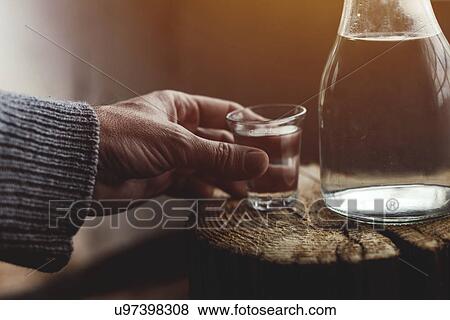Stock Photo - Man drinking rakija. Fotosearch