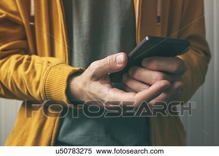 Man using smartphone View Large Photo Image Stock Photography - Man using smartphone. Fotosearch