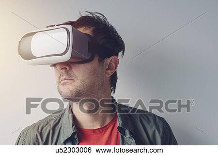Stock Photograph - Man with virtual reality goggles. Fotosearch