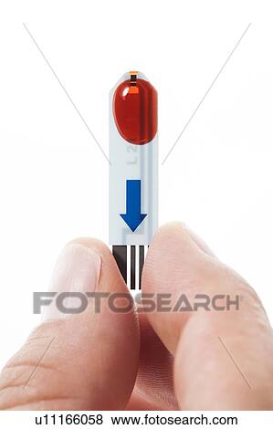 Stock Photo - MODEL RELEASED. Blood sample on glucose test strip, studio shot.. Fotosearch