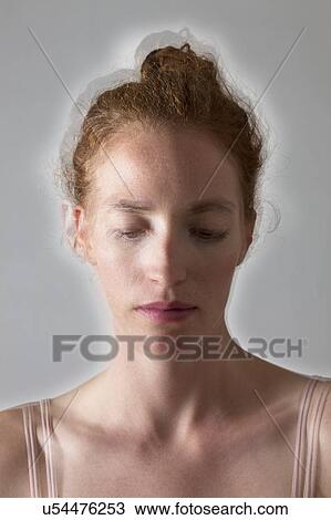 Stock Image - MODEL RELEASED. Composite image of depressed woman.. Fotosearch