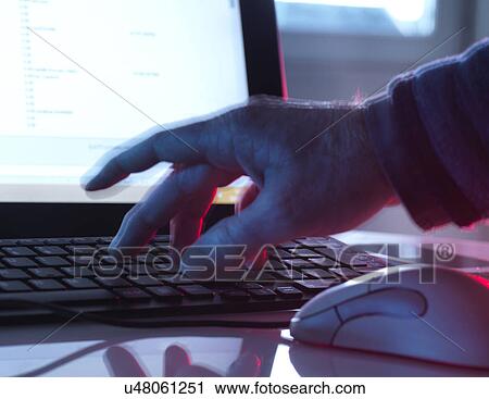 Stock Image - MODEL RELEASED. Computer hacking, conceptual image.. Fotosearch