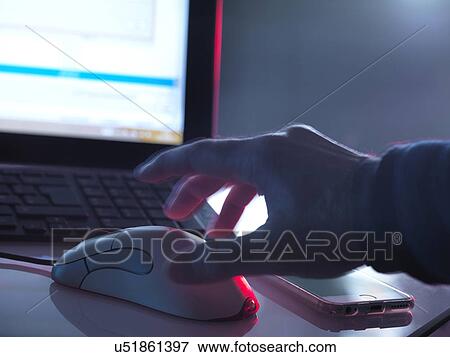 Stock Photo - MODEL RELEASED. Computer hacking, conceptual image.. Fotosearch