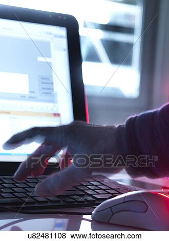 Stock Photo - MODEL RELEASED. Computer hacking, conceptual image.. Fotosearch