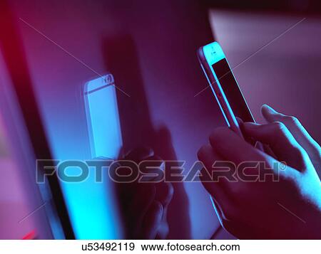 Stock Photo - MODEL RELEASED. Smartphone use.. Fotosearch