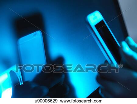 Stock Photo - MODEL RELEASED. Smartphone use.. Fotosearch