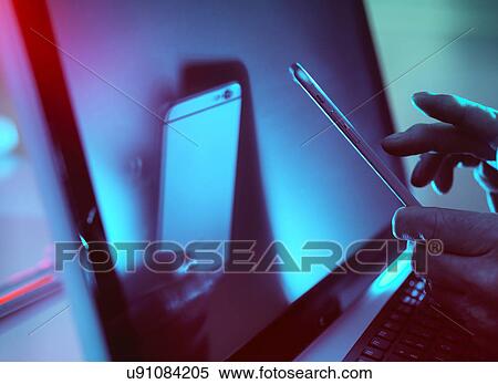 Stock Photography - MODEL RELEASED. Smartphone use.. Fotosearch