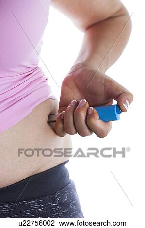 MODEL RELEASED. Woman injecting herself in her side. View Large Photo Image Stock Image - MODEL RELEASED. Woman injecting herself in her side.. Fotosearch