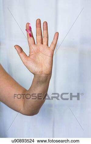 MODEL RELEASED. Woman with pink ribbon tied to finger. View Large Photo Image Picture - MODEL RELEASED. Woman with pink ribbon tied to finger.. Fotosearch