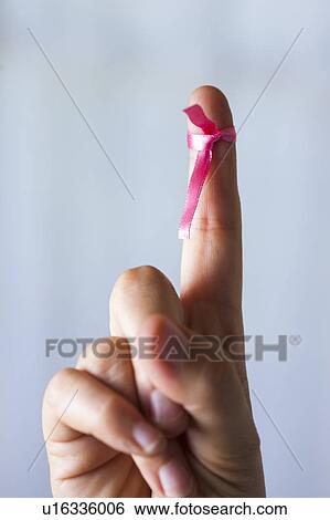 MODEL RELEASED. Woman with pink ribbon tied to finger. View Large Photo Image Stock Photograph - MODEL RELEASED. Woman with pink ribbon tied to finger.. Fotosearch