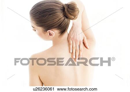 MODEL RELEASED. Young topless woman in pain touching her back. View Large Photo Image Stock Image - MODEL RELEASED. Young topless woman in pain touching her back.. Fotosearch