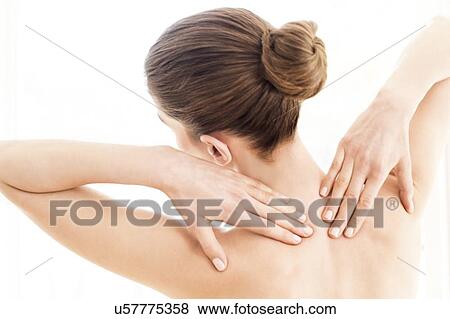 MODEL RELEASED. Young topless woman in pain touching her shoulders with both hands. View Large Photo Image Stock Photo - MODEL RELEASED. Young topless woman in pain touching her shoulders with both hands.. Fotosearch