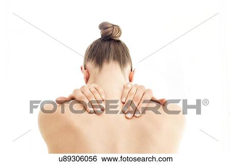 MODEL RELEASED. Young topless woman in pain touching her back with both hands. View Large Photo Image Stock Photograph - MODEL RELEASED. Young topless woman in pain touching her back with both hands.. Fotosearch