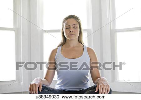 Portrait of young woman meditating. View Large Photo Image Stock Image - Portrait of young woman meditating.. Fotosearch