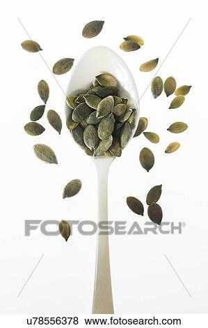 Pumpkin seeds on spoon, studio shot. View Large Photo Image Stock Photo - Pumpkin seeds on spoon, studio shot.. Fotosearch
