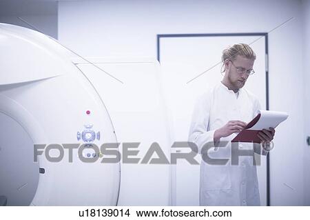 Picture - Radiologist checking notes. Fotosearch