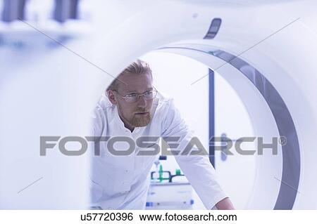 Stock Photograph - Radiologist with MRI machine. Fotosearch