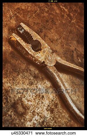 Stock Image - Rusty pliers.. Fotosearch
