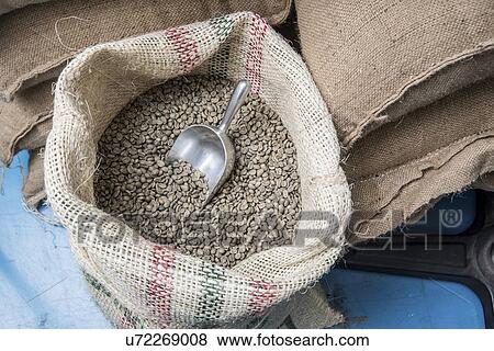 Stock Photo - Sacks of coffee beans at a coffee importer's warehouse.. Fotosearch
