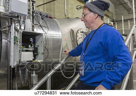 Water department engineer inspecting instrumentation panel. View Large Photo Image Stock Image - Water department engineer inspecting instrumentation panel.. Fotosearch