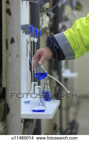 Water department engineer testing water sample. View Large Photo Image Picture - Water department engineer testing water sample.. Fotosearch
