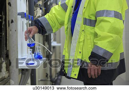 Water department engineer testing water sample. View Large Photo Image Stock Image - Water department engineer testing water sample.. Fotosearch