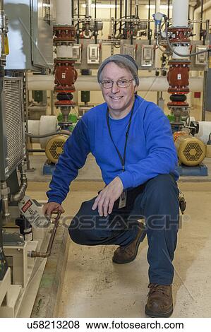 Water treatment engineer in treatment room. View Large Photo Image Stock Photo - Water treatment engineer in treatment room.. Fotosearch
