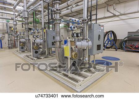 Stock Image - Water treatment plant chemical treatment equipment.. Fotosearch