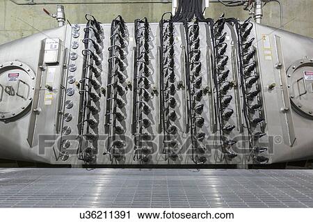 Stock Image - Water treatment plant ultraviolet ionization treatment equipment.. Fotosearch