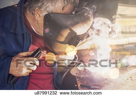 Welder in workshop View Large Photo Image Stock Image - Welder in workshop. Fotosearch
