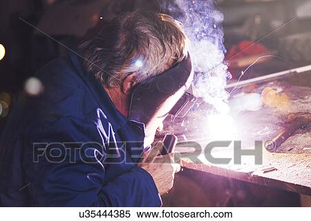 Welder in workshop View Large Photo Image Stock Photography - Welder in workshop. Fotosearch