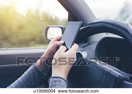 Woman driving and texting View Large Photo Image Picture - Woman driving and texting. Fotosearch